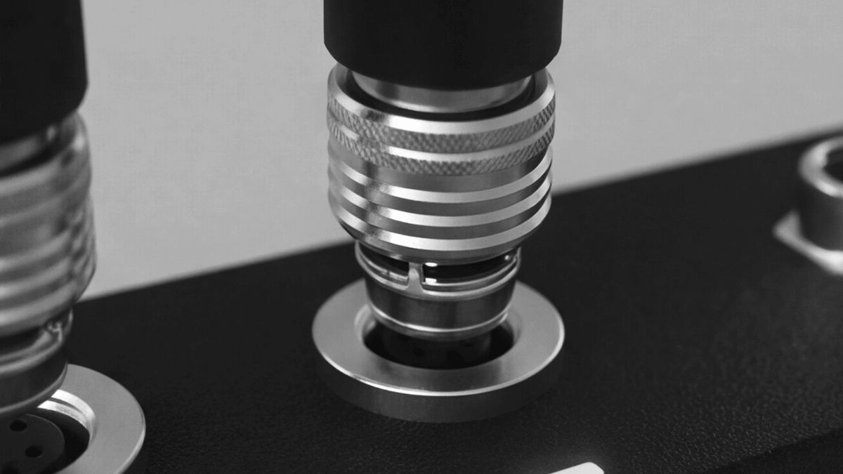 Technician servicing a modular industrial device with an accessible M12 connection